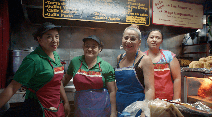 A group of women pose at the central market in Heredia Costa Rica